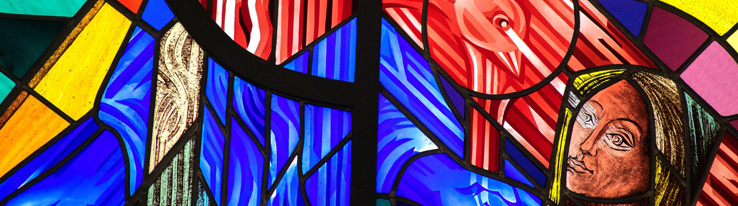Stain glass image of a woman looking up